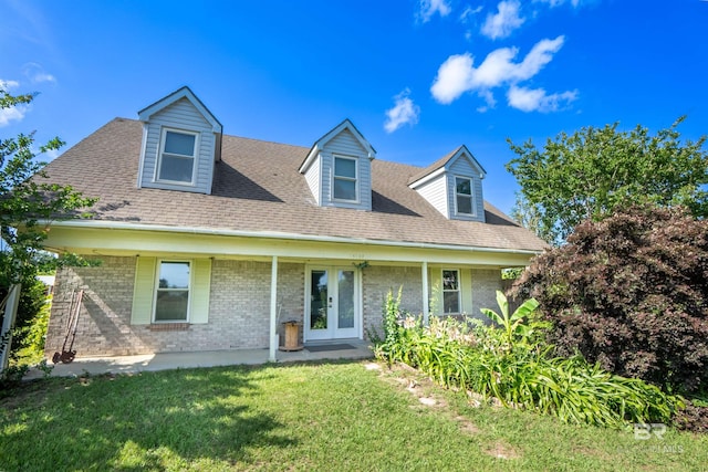 48851 Colt Run, Bay Minette, AL 36507 - cape cod home featuring a front yard, brick siding, french doors, and a shingled roof