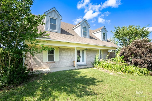 48851 Colt Run, Bay Minette, AL 36507 - new england style home featuring brick siding, a front yard, and a shingled roof