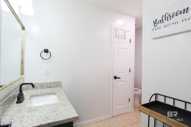 bathroom with tile patterned floors, vanity, and toilet