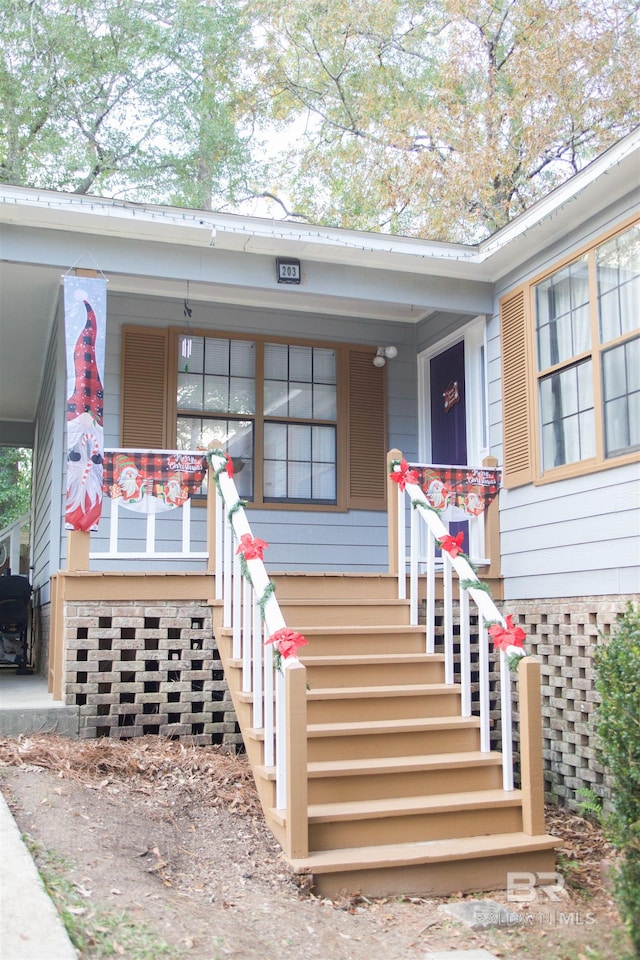 doorway to property with a porch