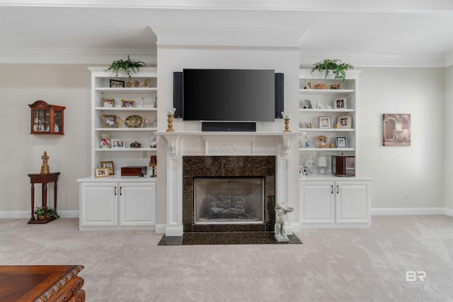 unfurnished living room with built in features, ornamental molding, light carpet, and a premium fireplace