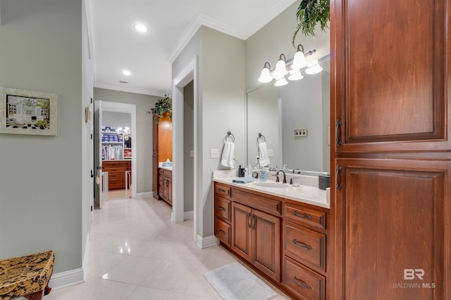 bathroom with crown molding, vanity, and tile patterned floors