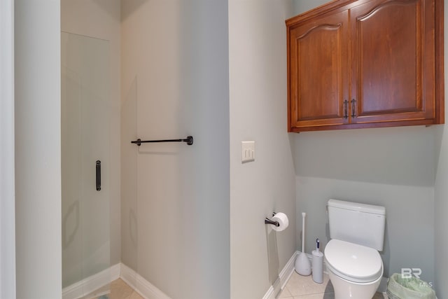 bathroom with tile patterned flooring and toilet