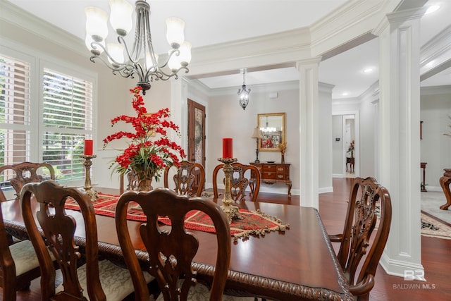 dining area featuring ornamental molding, ornate columns, and dark hardwood / wood-style floors