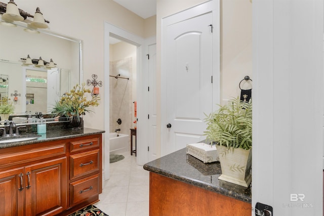 bathroom featuring vanity, shower / tub combination, and tile patterned floors