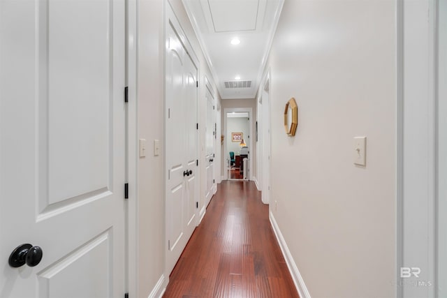 hall with crown molding and dark wood-type flooring