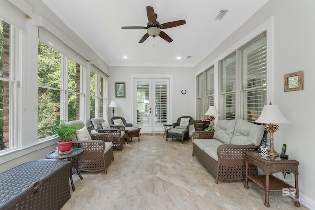 sunroom / solarium with french doors, ceiling fan, and a healthy amount of sunlight