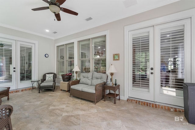 living area with crown molding, ceiling fan, french doors, and light tile patterned flooring