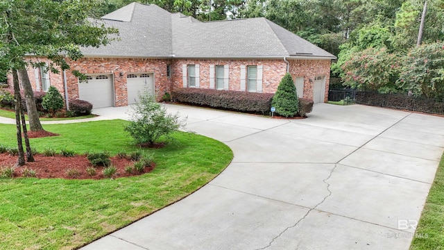 view of front facade with a garage and a front yard