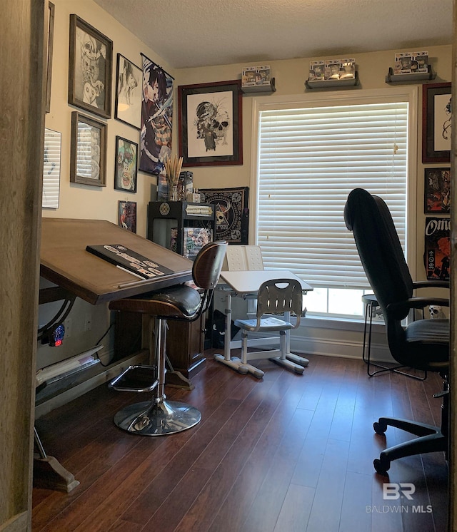 office with a textured ceiling and hardwood / wood-style flooring