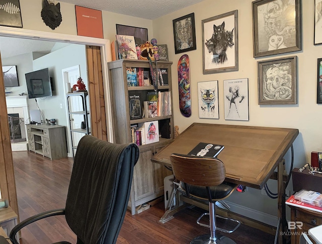 office featuring a textured ceiling and wood finished floors