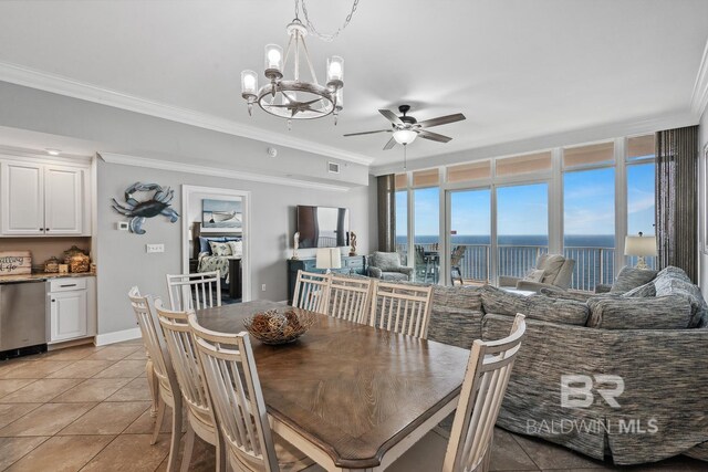25494 Perdido Beach Blvd Unit 2005, Orange Beach, AL 36561 - dining room with crown molding, baseboards, ceiling fan with notable chandelier, and light tile patterned flooring
