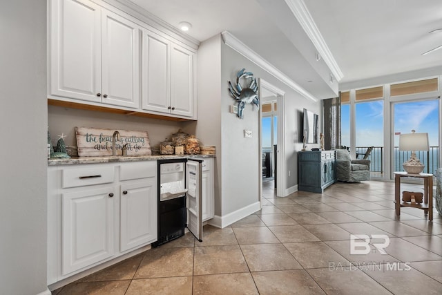 25494 Perdido Beach Blvd Unit 2005, Orange Beach, AL 36561 - interior space featuring crown molding, a sink, baseboards, and light tile patterned flooring