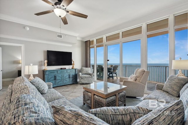 25494 Perdido Beach Blvd Unit 2005, Orange Beach, AL 36561 - living room featuring crown molding, a ceiling fan, baseboards, light tile patterned floors, and visible vents