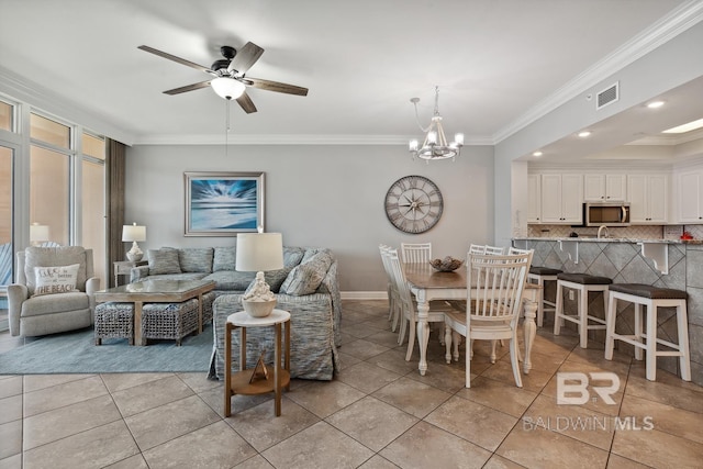 25494 Perdido Beach Blvd Unit 2005, Orange Beach, AL 36561 - living room with visible vents, crown molding, baseboards, ceiling fan with notable chandelier, and light tile patterned flooring