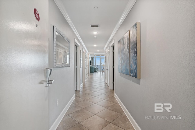 25494 Perdido Beach Blvd Unit 2005, Orange Beach, AL 36561 - hallway with visible vents, crown molding, tile patterned floors, baseboards, and recessed lighting