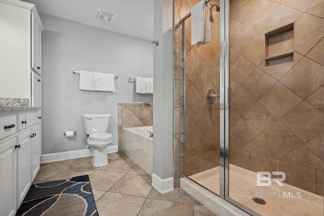 25494 Perdido Beach Blvd Unit 2005, Orange Beach, AL 36561 - full bathroom with visible vents, a garden tub, toilet, tile patterned floors, and a stall shower
