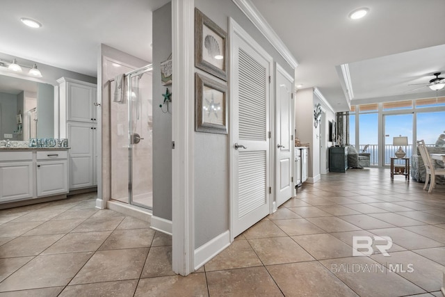 25494 Perdido Beach Blvd Unit 2005, Orange Beach, AL 36561 - hallway featuring recessed lighting, baseboards, ornamental molding, and light tile patterned floors