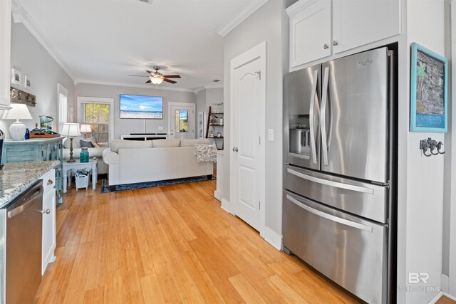 5781 State Highway 180 Unit 6020, Gulf Shores, AL 36542 - kitchen with light stone counters, crown molding, light hardwood / wood-style flooring, stainless steel appliances, and white cabinets