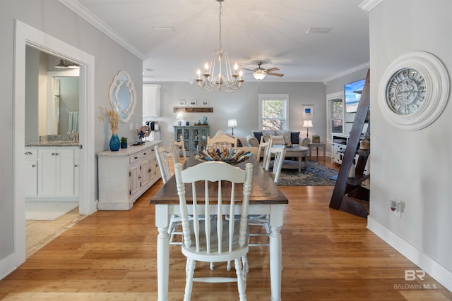 5781 State Highway 180 Unit 6020, Gulf Shores, AL 36542 - dining room featuring ceiling fan with notable chandelier, ornamental molding, and light wood-type flooring