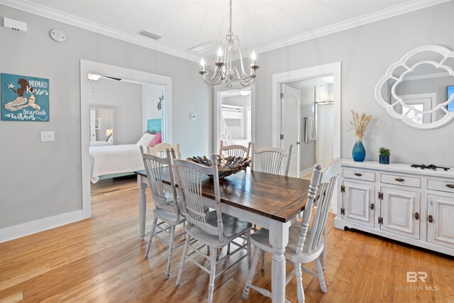 5781 State Highway 180 Unit 6020, Gulf Shores, AL 36542 - dining space with crown molding, a notable chandelier, and light hardwood / wood-style flooring