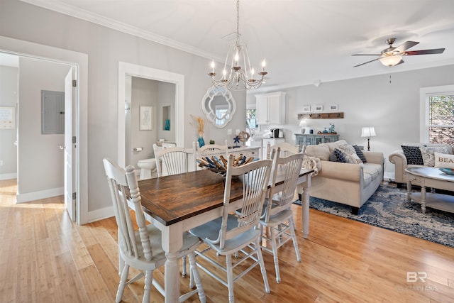 5781 State Highway 180 Unit 6020, Gulf Shores, AL 36542 - dining space featuring ceiling fan with notable chandelier, light hardwood / wood-style flooring, and ornamental molding