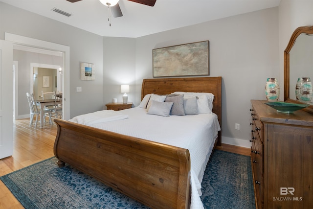 5781 State Highway 180 Unit 6020, Gulf Shores, AL 36542 - bedroom featuring wood-type flooring and ceiling fan