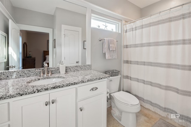 5781 State Highway 180 Unit 6020, Gulf Shores, AL 36542 - bathroom featuring vanity, toilet, and tile patterned flooring