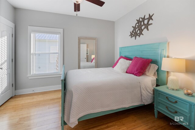 5781 State Highway 180 Unit 6020, Gulf Shores, AL 36542 - bedroom with ceiling fan and light hardwood / wood-style flooring