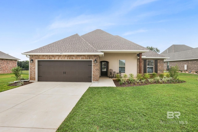 view of front of house with a garage and a front lawn