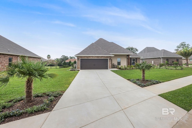 view of front of property with a garage and a front yard