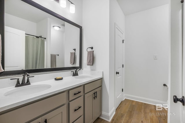 bathroom featuring vanity and wood-type flooring