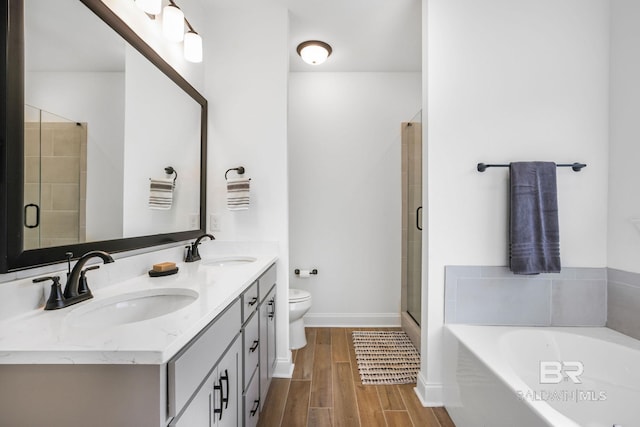 full bathroom featuring vanity, toilet, and shower with separate bathtub