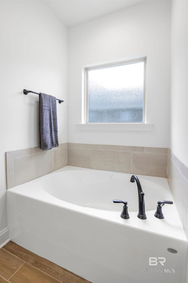 bathroom featuring a tub