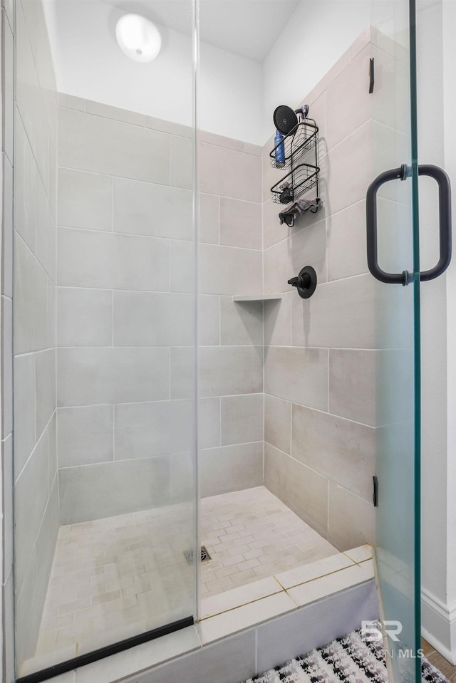 bathroom featuring an enclosed shower