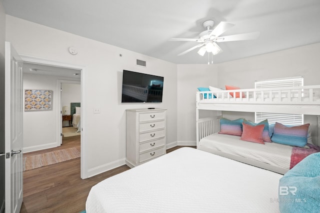 bedroom featuring ceiling fan and dark hardwood / wood-style flooring