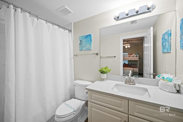 bathroom with toilet and vanity