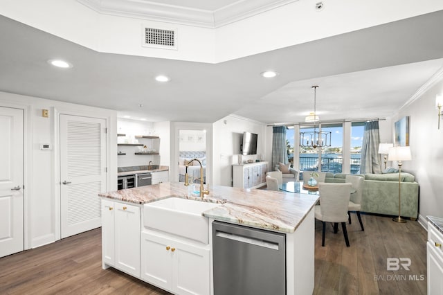 kitchen with white cabinetry, an inviting chandelier, sink, stainless steel dishwasher, and a center island with sink