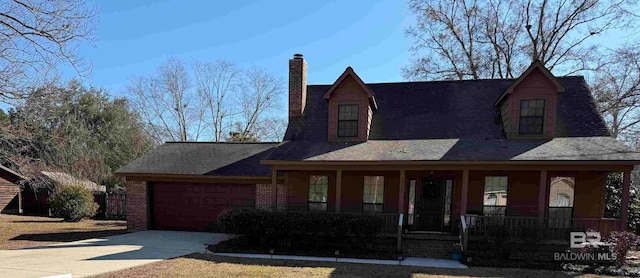 view of front of house with a garage and a porch