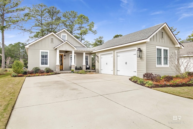 view of front of property with roof with shingles, a porch, concrete driveway, an attached garage, and board and batten siding