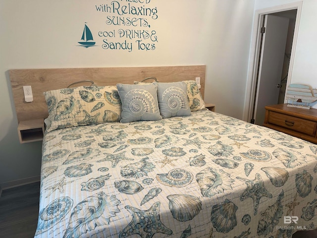 bedroom with dark wood-type flooring