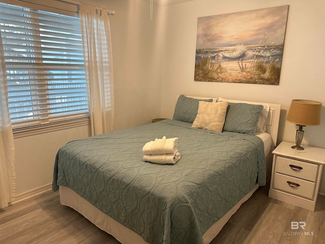 bedroom with wood-type flooring