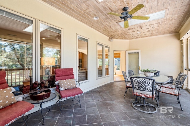 view of patio featuring outdoor dining area and ceiling fan