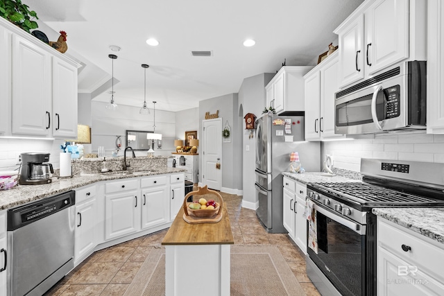 kitchen featuring white cabinetry, sink, and appliances with stainless steel finishes