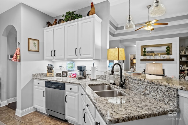 kitchen featuring stainless steel dishwasher, ceiling fan, crown molding, sink, and white cabinets