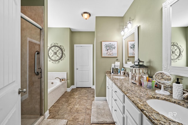 bathroom with tile patterned floors, vanity, and separate shower and tub