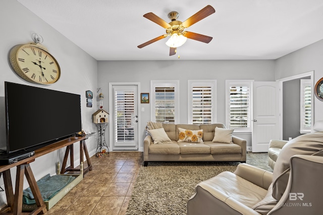 living room with tile patterned floors and ceiling fan