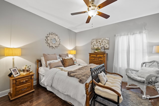 bedroom featuring dark hardwood / wood-style floors, ceiling fan, and vaulted ceiling