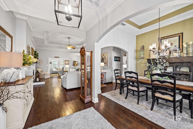 dining space with ceiling fan with notable chandelier, dark hardwood / wood-style flooring, and ornamental molding