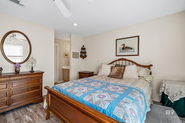 bedroom with a ceiling fan, recessed lighting, visible vents, and wood finished floors